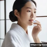 피부 미용사가 알아야 할 화장품 성분 - A serene skincare scene featuring a young Japanese woman with clear, hydrated skin gently applying a...